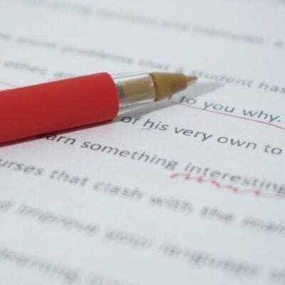 a pen and a paper with underlined text